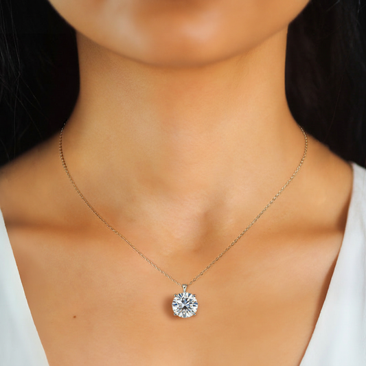 Close-up of 18K Gold-Plated Diamond Solitaire Necklace on Asian model's collarbone