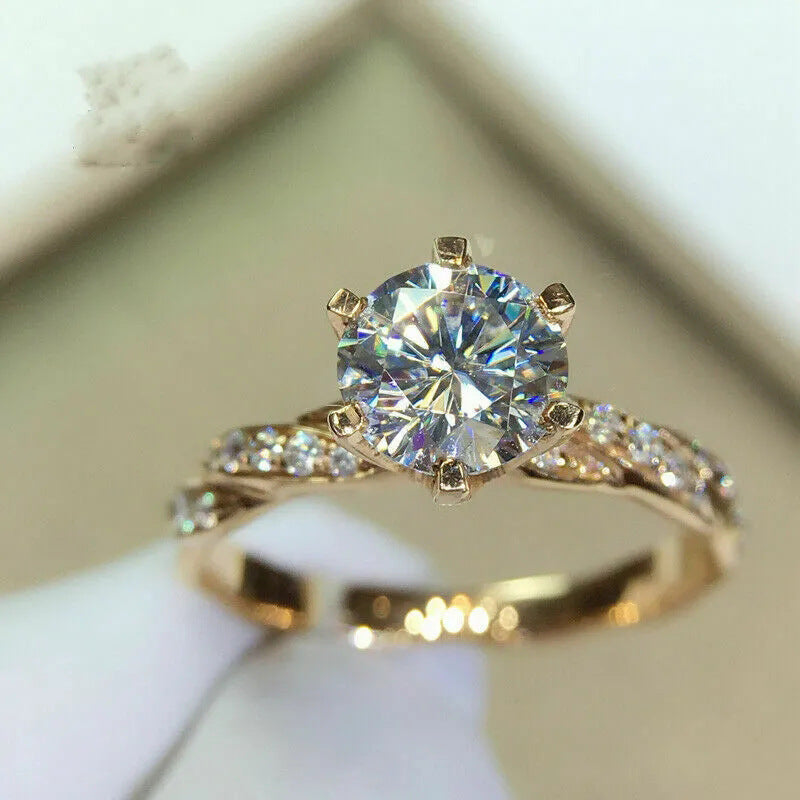 Sovereign Radiance™ Twist Ring – 6-Claw Moissanite in 18K Gold, Built to Turn Heads