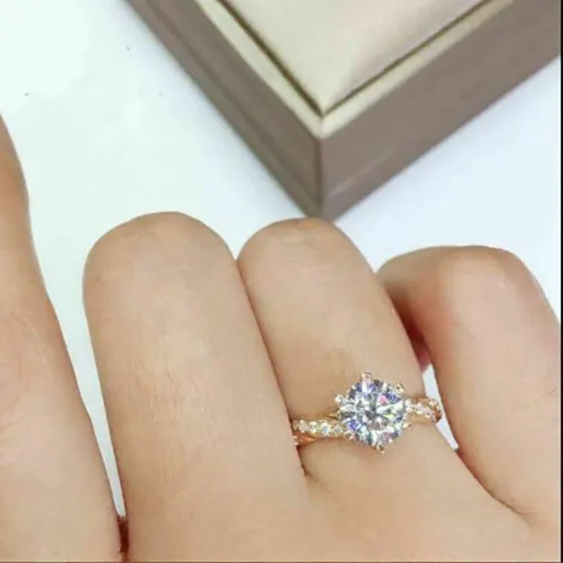 Sovereign Radiance™ Twist Ring – 6-Claw Moissanite in 18K Gold, Built to Turn Heads