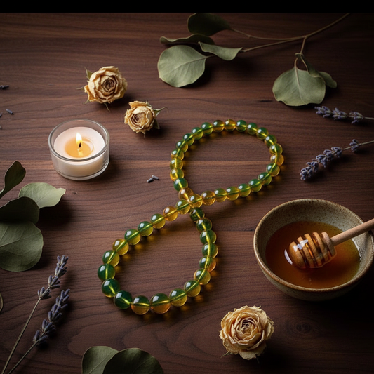 Amber Beeswax Bead Necklace flat lay on dark walnut with botanicals