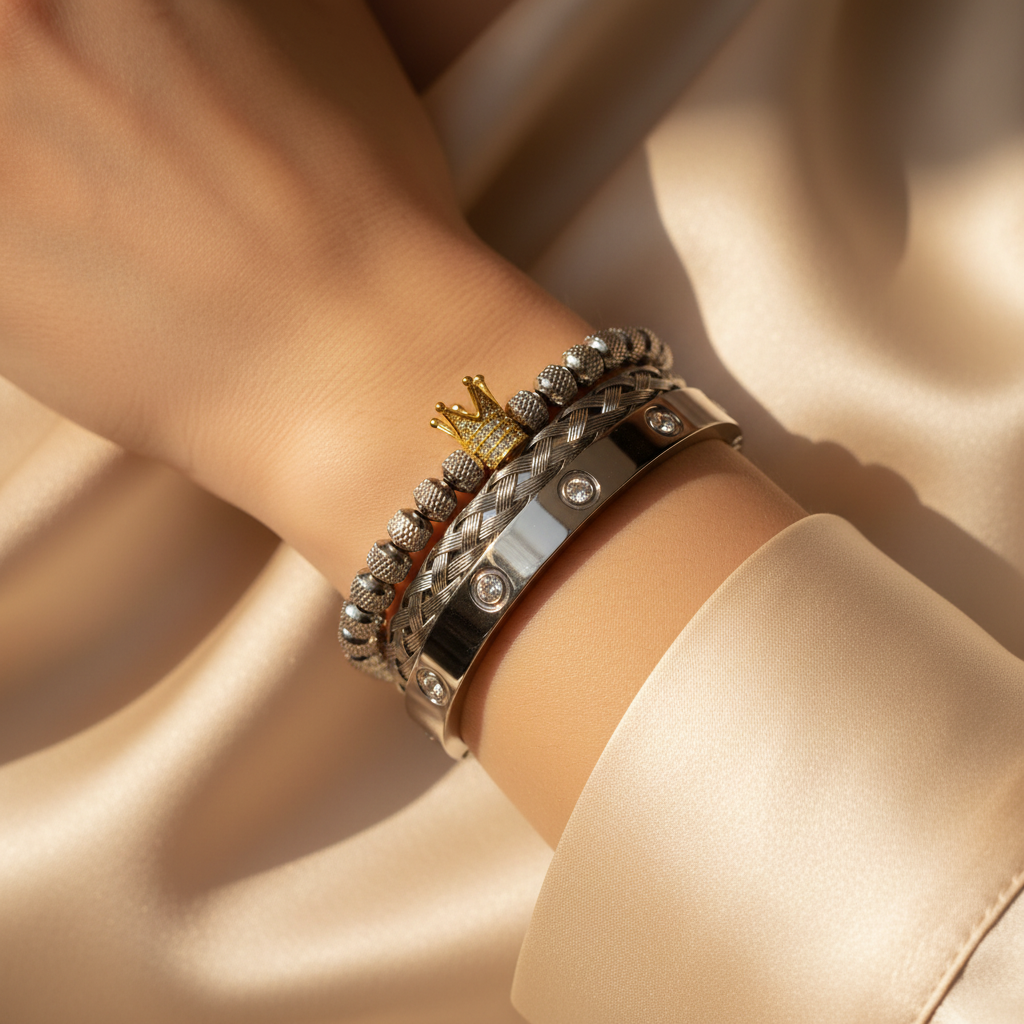 Close-up of Pineapple Crown Bracelet Set stacked on Caucasian model's wrist